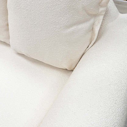 Close-up of the plush pillow back cushions, showcasing the comfort and sophisticated finish of the Alyssia collection.