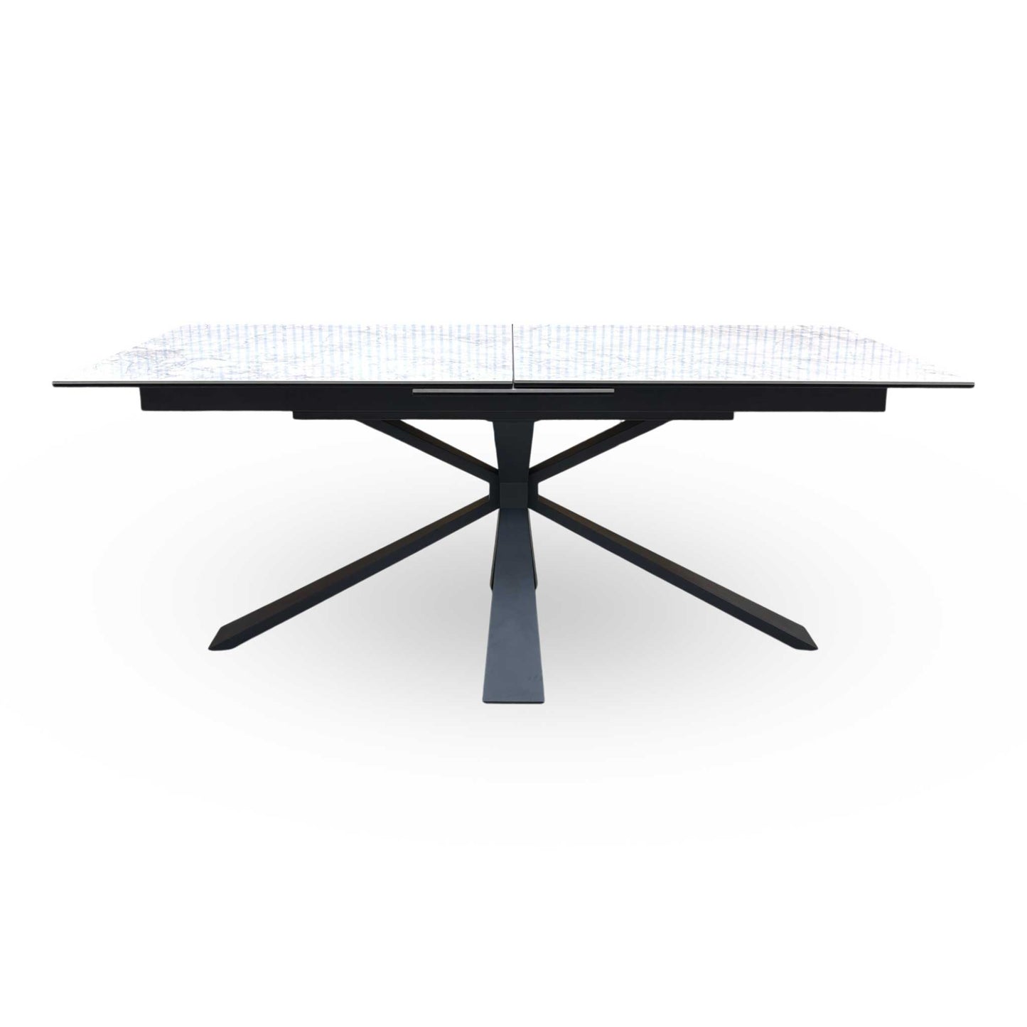 Front-facing view of the Crete dining table closed at 180cm, showcasing the flawless continuous ceramic pattern and its sleek, bold modern aesthetic.