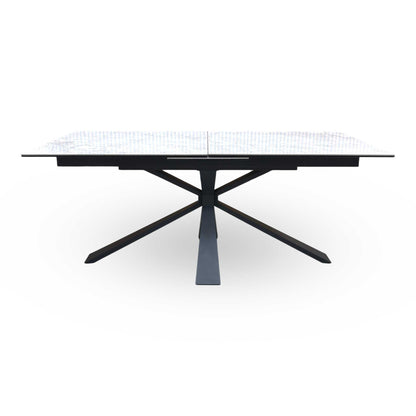 Front-facing view of the Crete dining table closed at 180cm, showcasing the flawless continuous ceramic pattern and its sleek, bold modern aesthetic.