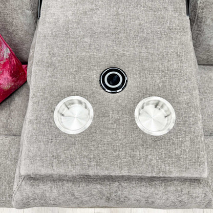 Close-up of the drop-down console, showing the two integrated cup holders and the flat tray surface for snacks or remotes.