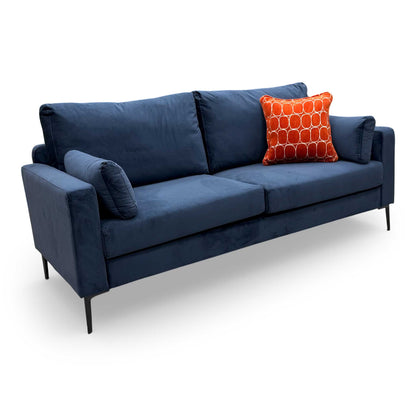 Front view of the ‘Wren’ 3-seater sofa in Navy Blue Velvet, featuring a sleek formal back and modern sloped arms.