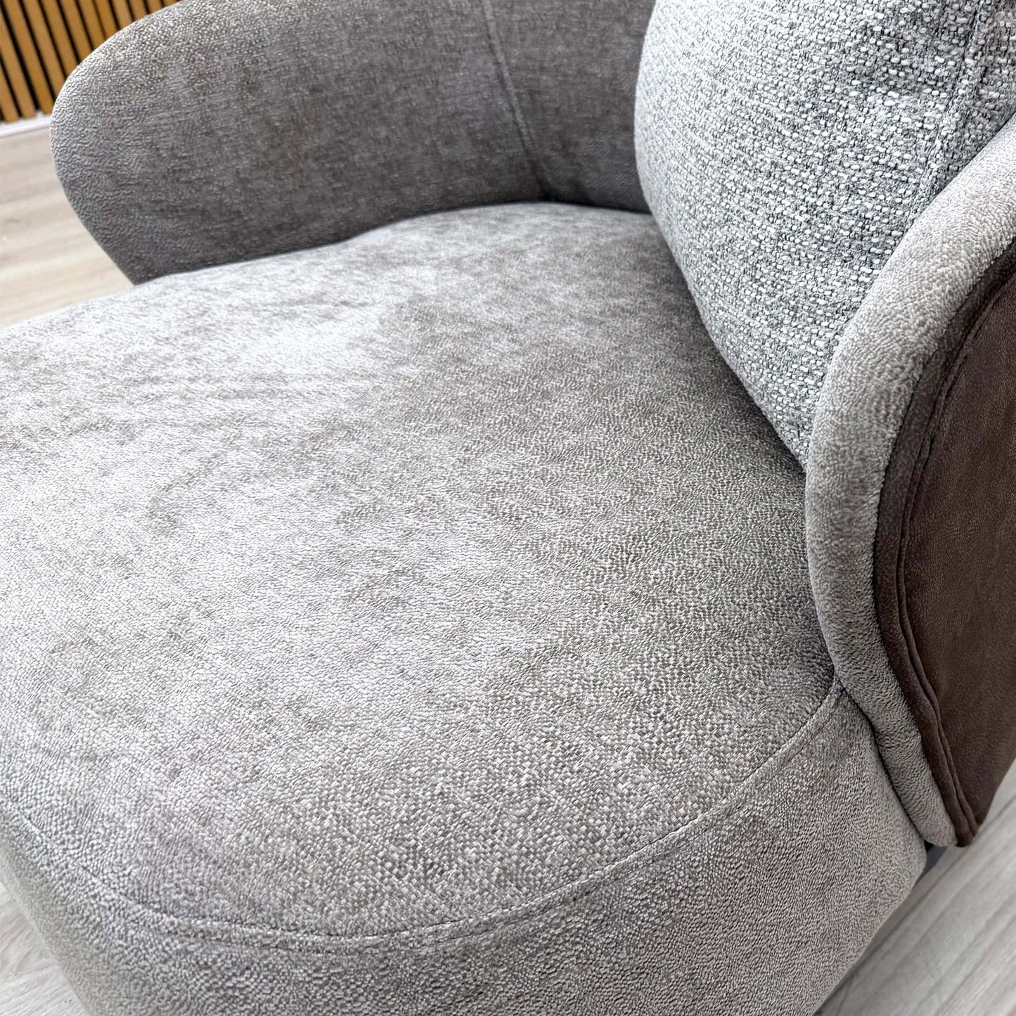 Close-up of the brown combination upholstery fabric, emphasizing the sophisticated weave and rich color.