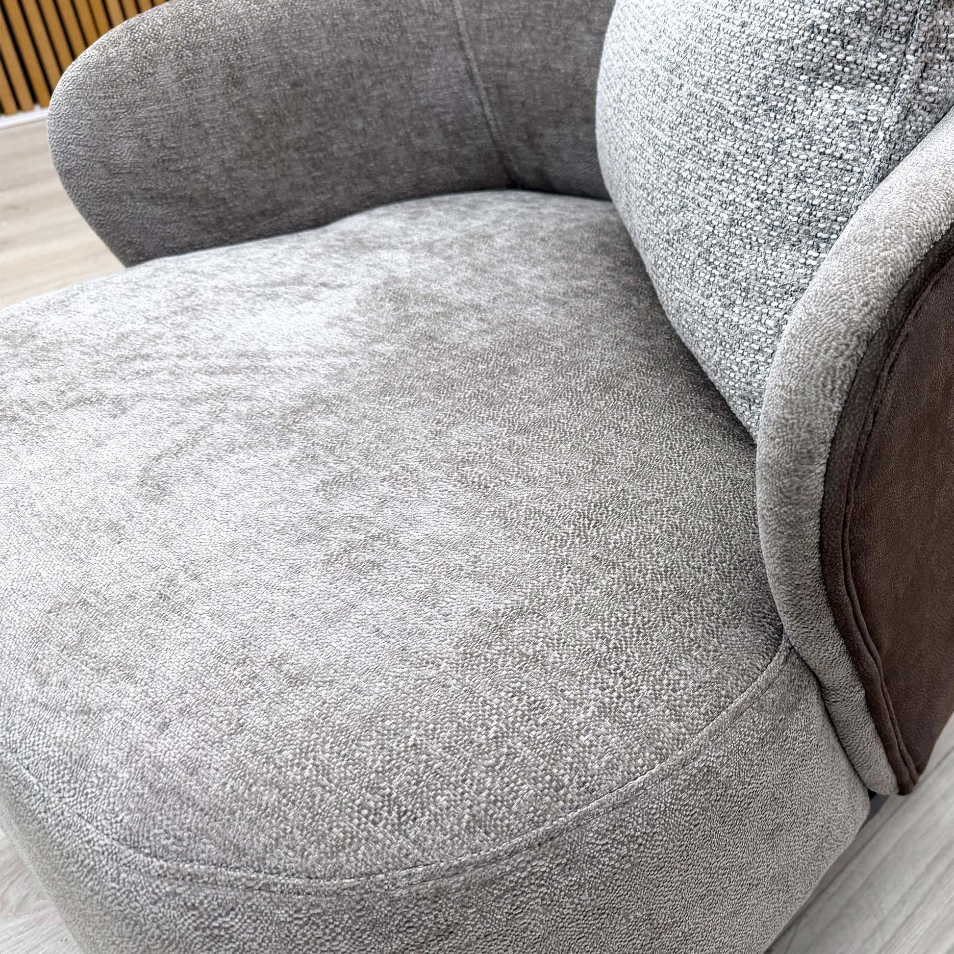 Close-up of the brown combination upholstery fabric, emphasizing the sophisticated weave and rich color.