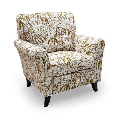 Front view of the ‘Pippa’ armchair in Mustard Floral Patterned Fabric, featuring elegant scroll arms and a contemporary design.