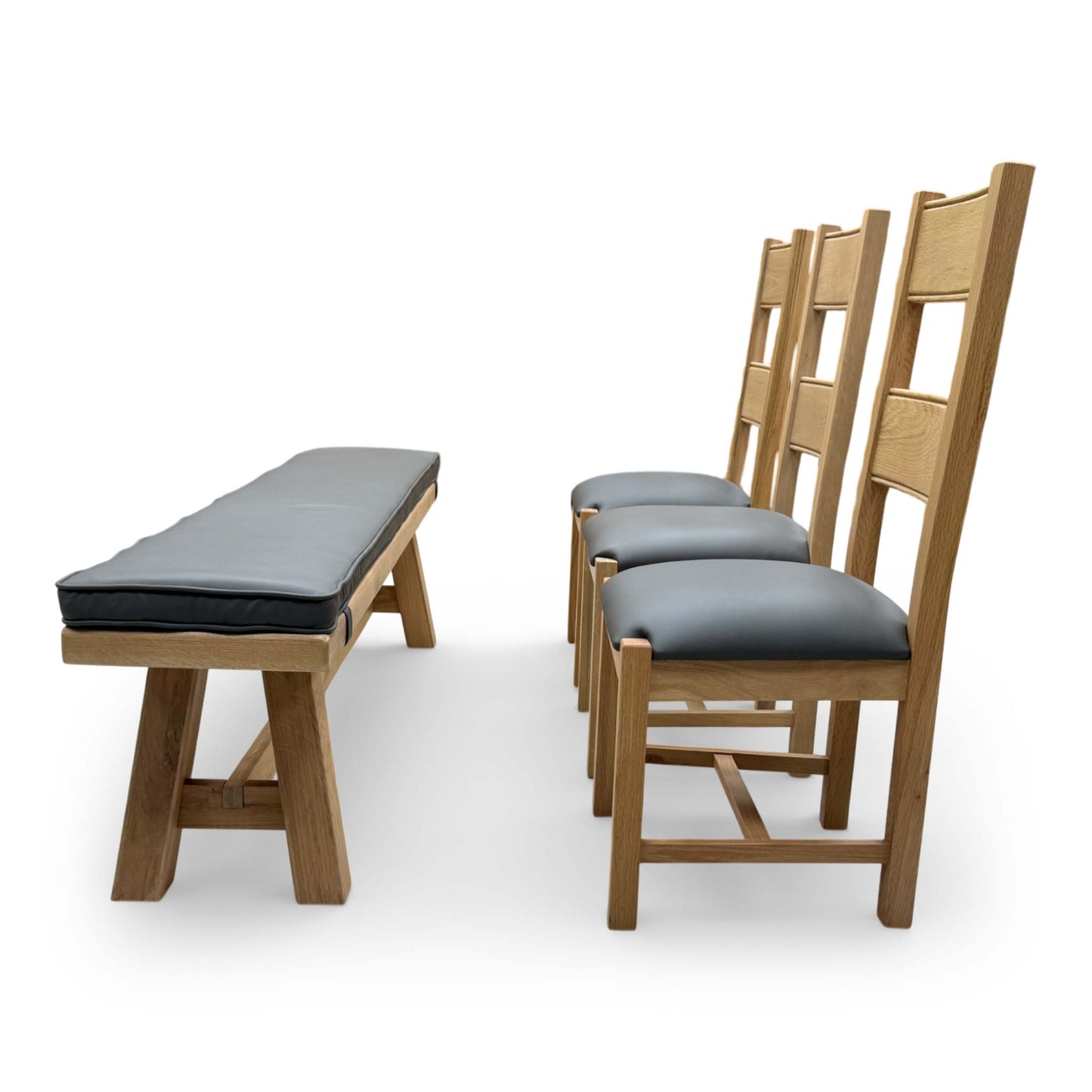 View of a single Delaney dining chair, featuring a tall slat back and comfortable grey upholstered seat.