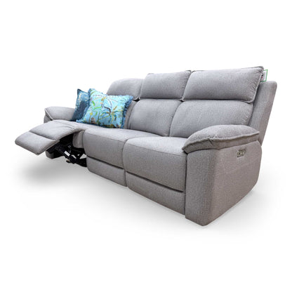 Side view of the sofa with one section fully reclined, showing the extended footrest and comfortable lounging angle.