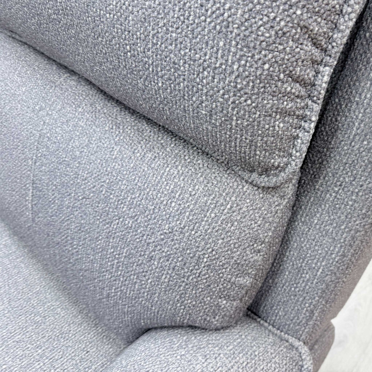 Close-up of the thick woven fabric in greige, highlighting the durable texture and quality stitching of the Blaine sofa.