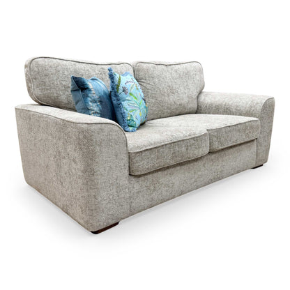 Side profile of the Emilia silver fabric sofa bed, emphasizing its space-saving design for compact rooms.