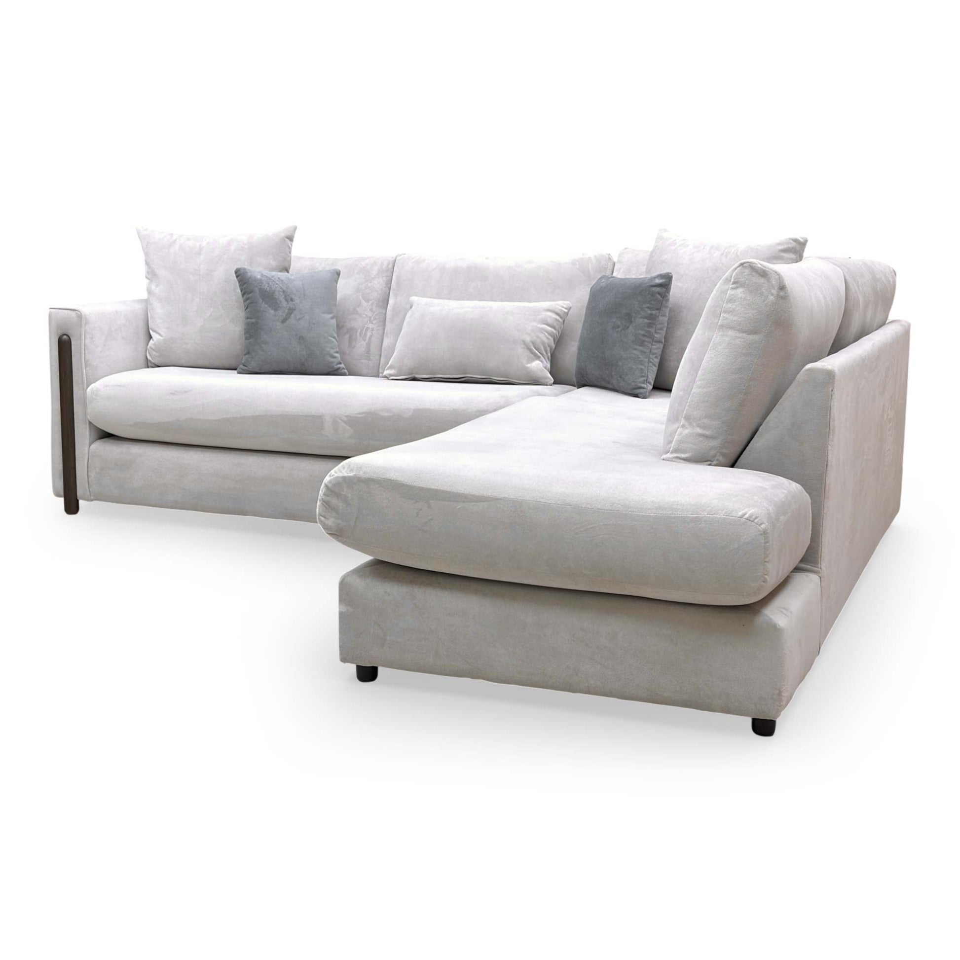 Side view of the Barney sofa from a high angle, illustrating the generous seating capacity and formal backrest arrangement.