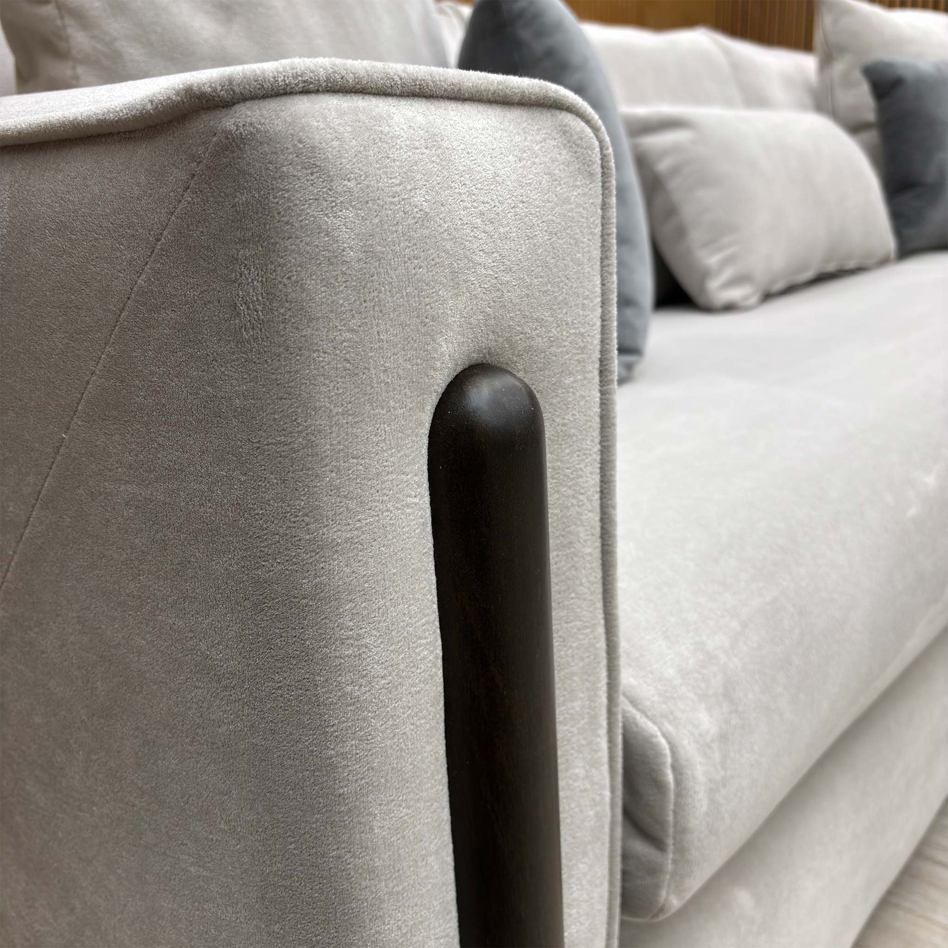 Close-up of the silver towel velvet upholstery, showcasing the fine, textured weave and sophisticated silver-grey tone.