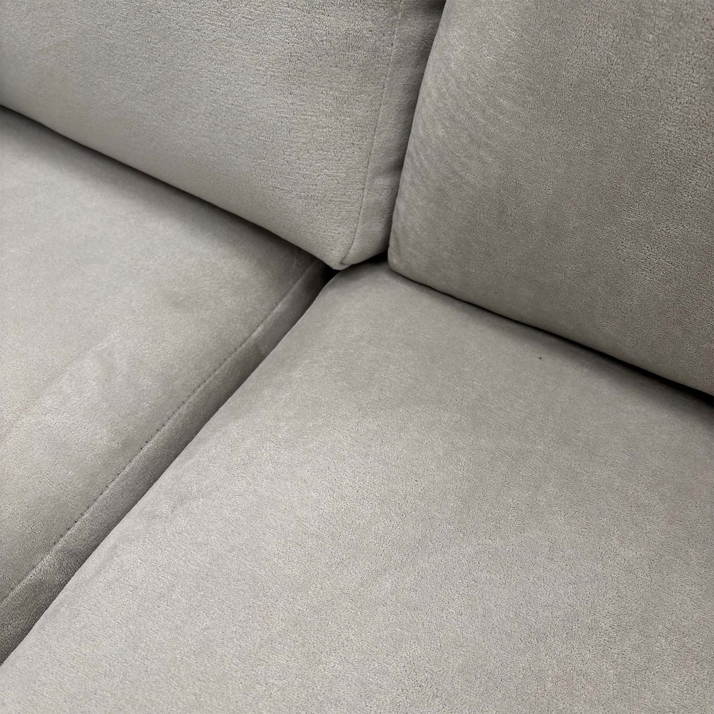 Detailed shot of the sofa's corner section, highlighting the seamless transition between the main seating and the chaise.