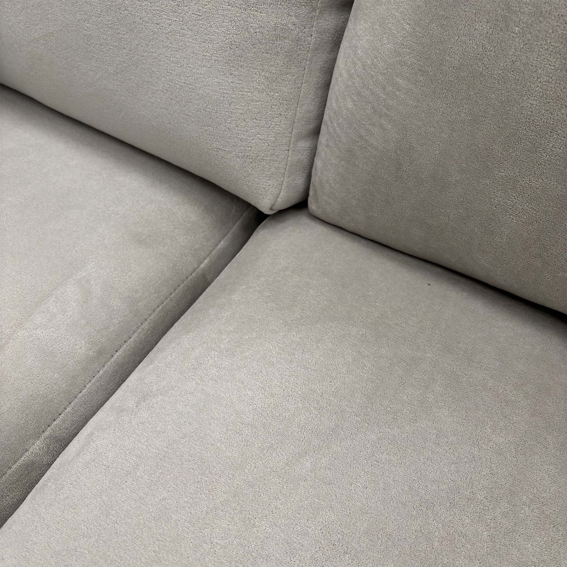 Detailed shot of the sofa's corner section, highlighting the seamless transition between the main seating and the chaise.