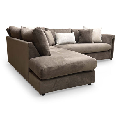 Side profile of the Barney sofa, showcasing the clean lines of the formal back and the height of the cushioned armrests.