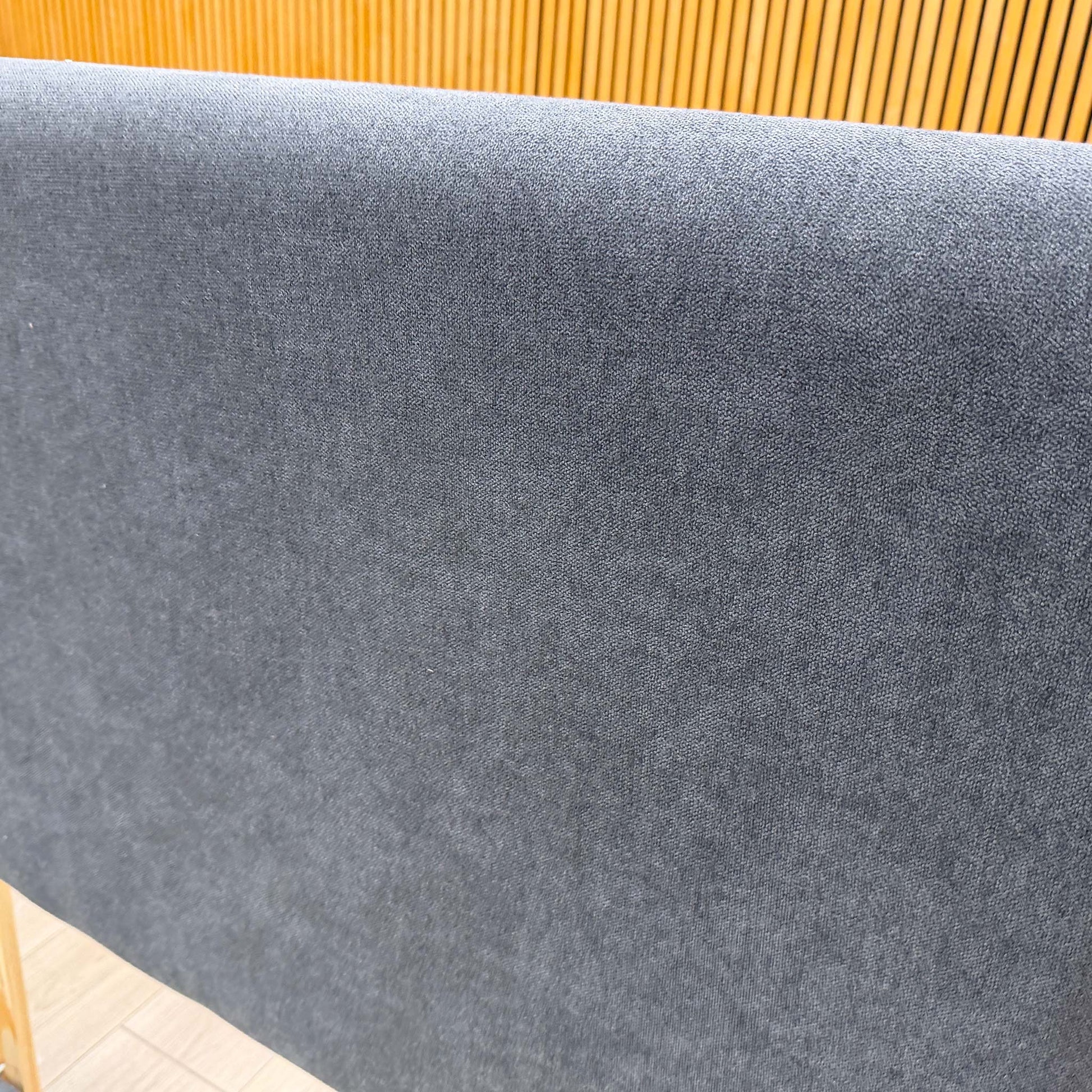 Close-up profile shot of the showing the deep padding and how the vertical panel stitching wraps around the side edge.