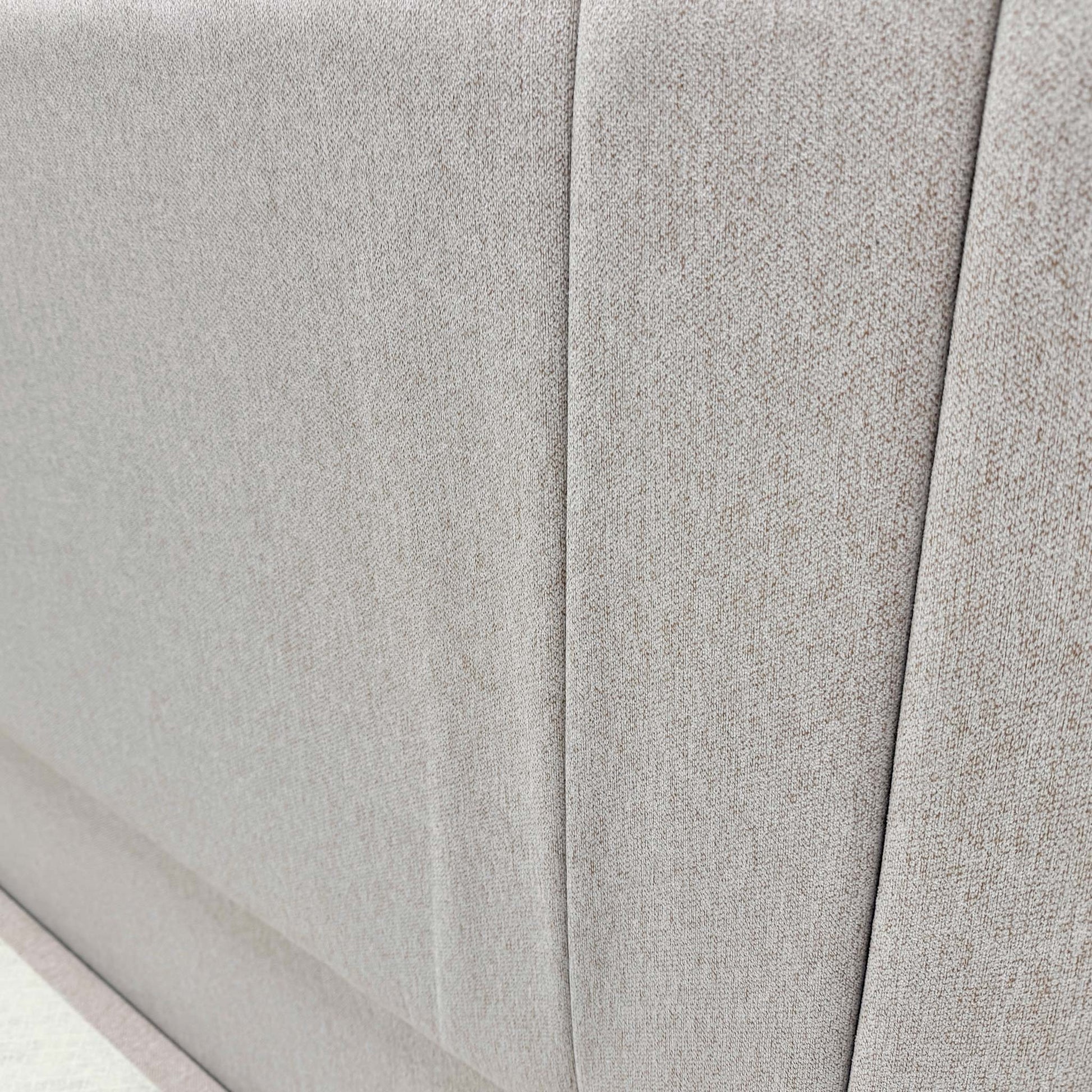 Close-up of the Orkney Oat fabric, showcasing the premium woven texture and neutral cream/beige tone of the upholstery.