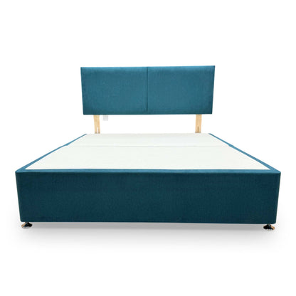 Front view of the Bella king-size bed, emphasizing the bold teal color and functional under-bed storage drawers.