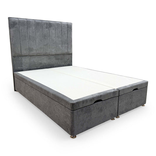Full View view of the Highgrove ‘Pluto’ Double Bed featuring a tall floor-standing headboard and an ottoman divan base upholstered in Milan Thunder gray velvet.