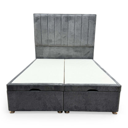 Front view of the Highgrove ‘Pluto’ Double Bed featuring a tall floor-standing headboard and an ottoman divan base upholstered in Milan Thunder gray velvet.