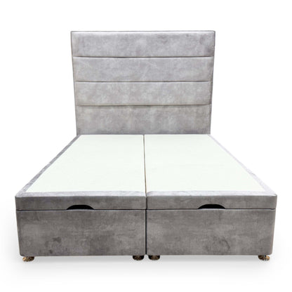 Front view of the Highgrove ‘Pisces’ Double Bed featuring a floor-standing headboard and end-lift ottoman base in Lace Dolphin gray velvet.