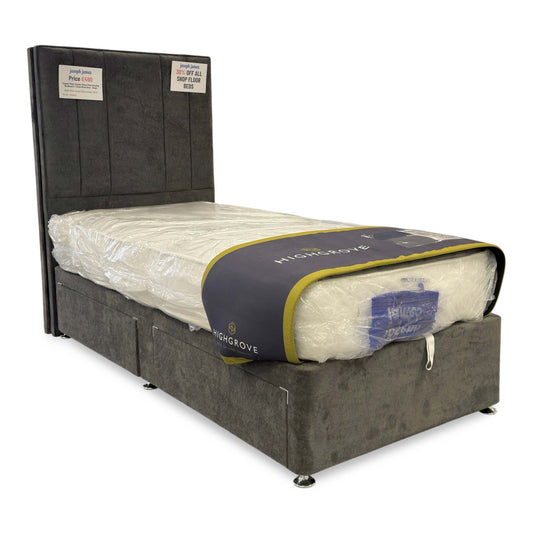 Full view of the Cygnus Single Divan Bed set in Milan Thunder velvet, featuring a tall floor-standing headboard with deep vertical channel tufting and a matching two-drawer base.