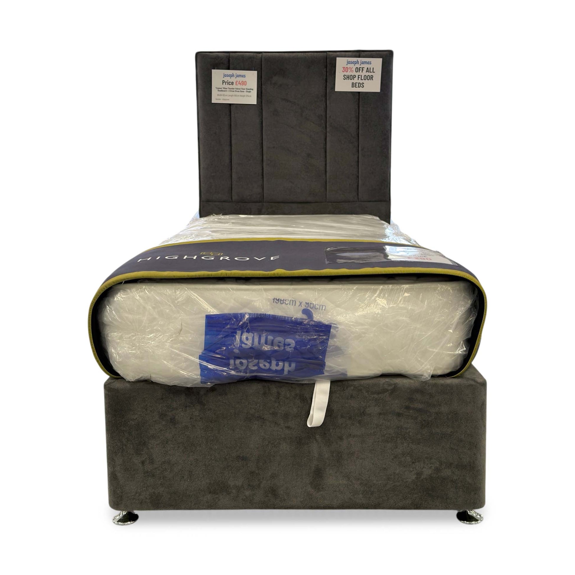 Front view of the Cygnus Single Bed, highlighting the luxurious Milan Thunder dark grey velvet upholstery and the seamless floor-standing headboard design.