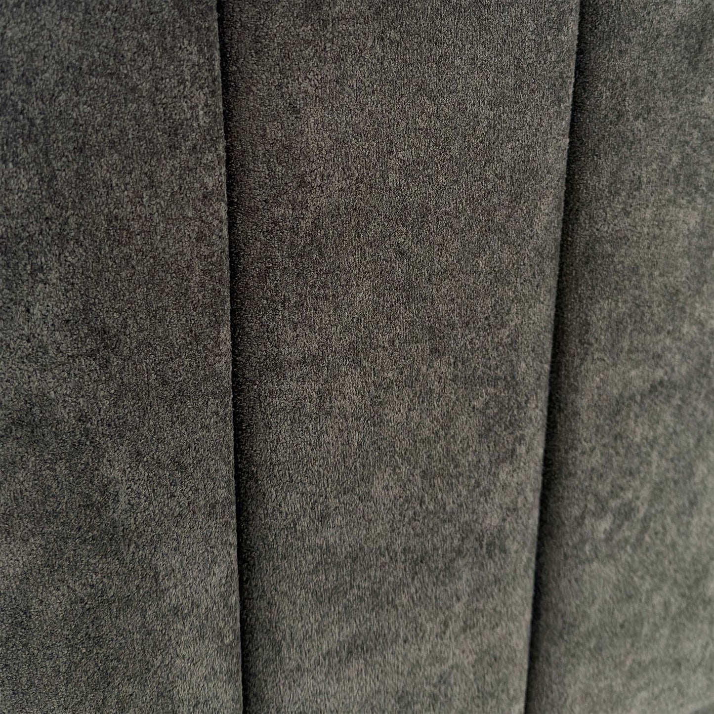 Close-up of the Milan Thunder velvet fabric, showing the rich dark grey tones, shimmering finish, and premium vertical stitching.