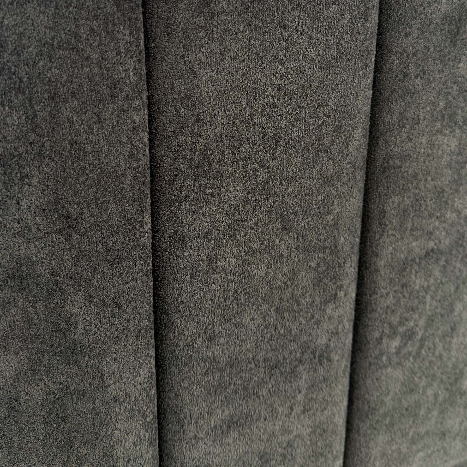 Close-up of the Milan Thunder velvet fabric, showing the rich dark grey tones, shimmering finish, and premium vertical stitching.