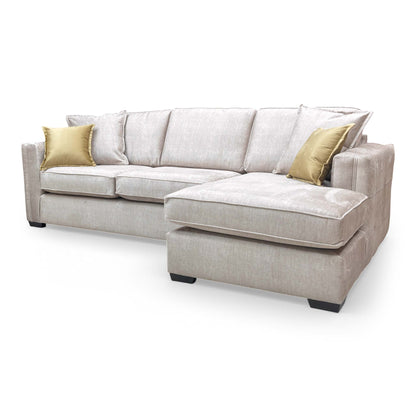 Side view of the Chelsea corner chaise, emphasizing the deep seat cushions and the elegant curve of the right-arm facing design.