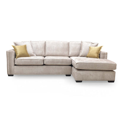 Front angle of the beige velvet Chelsea corner chaise, showing the spacious lounging area and modern English arm style.