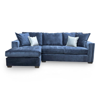 Front view of the large Chelsea corner sofa in Meridian Truffle, showing the spacious chaise section and modern English arm style.