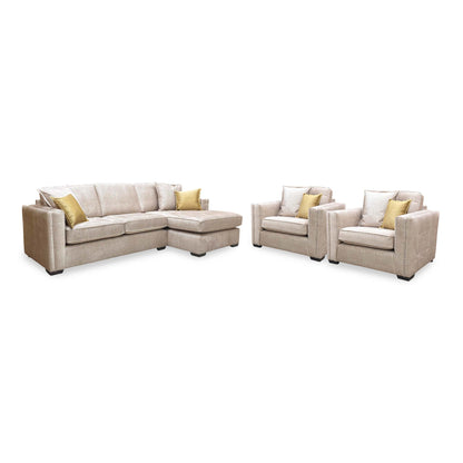 Chelsea beige velvet corner chaise sofa with the two snuggler chairs from the set, angled with chairs on the right