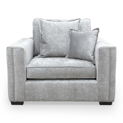 Front view of the Chelsea cuddler chair in Meridian Truffle, showcasing its wide seating area and modern English arm style.