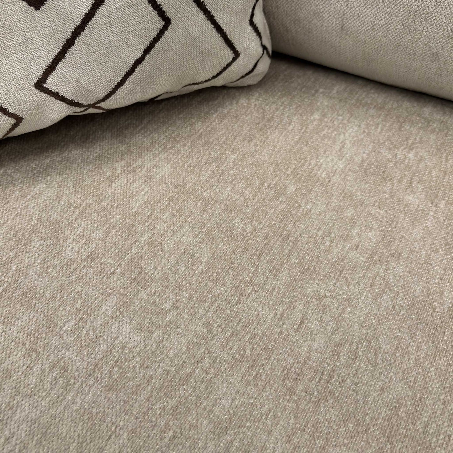 Close-up of the Truffle Derwent soft weave fabric, illustrating the premium texture and neutral color palette of the Harvey sofa.