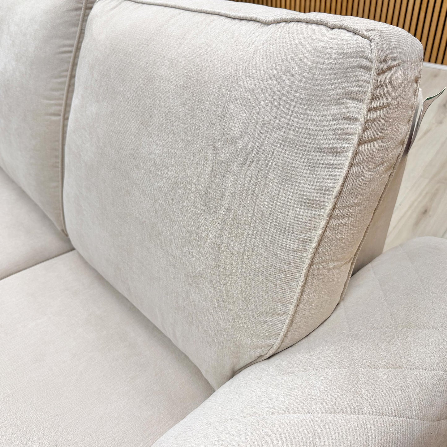 Close-up of the Cream Plaza Linen fabric texture, showing the durable weave and neutral tone suitable for any living room.