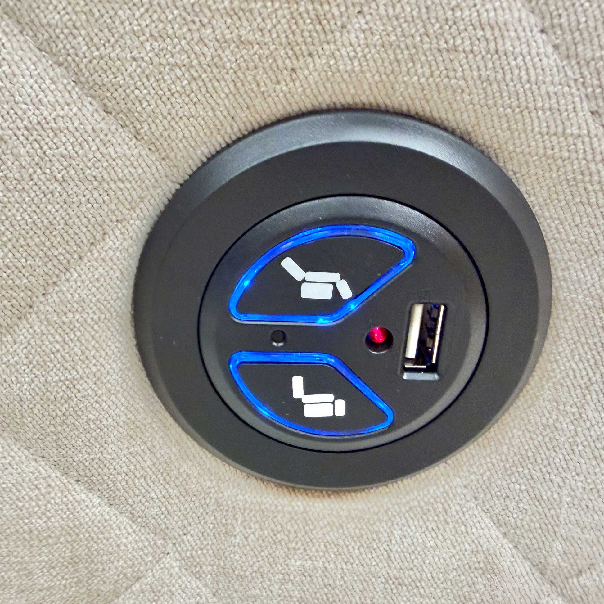 Close-up of the power recliner controls on the side of the sofa, featuring a convenient button for easy adjustment.
