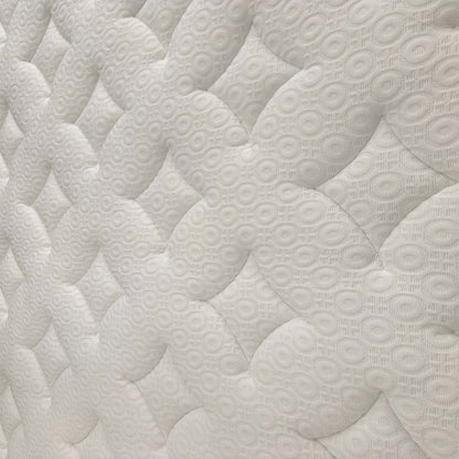 Detailed shot of the quilted surface, emphasizing the soft-touch fabric and integrated memory foam for pressure relief.