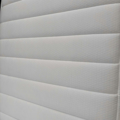Detailed shot of the top fabric, highlighting the hypoallergenic materials designed for a healthy sleep environment for children.