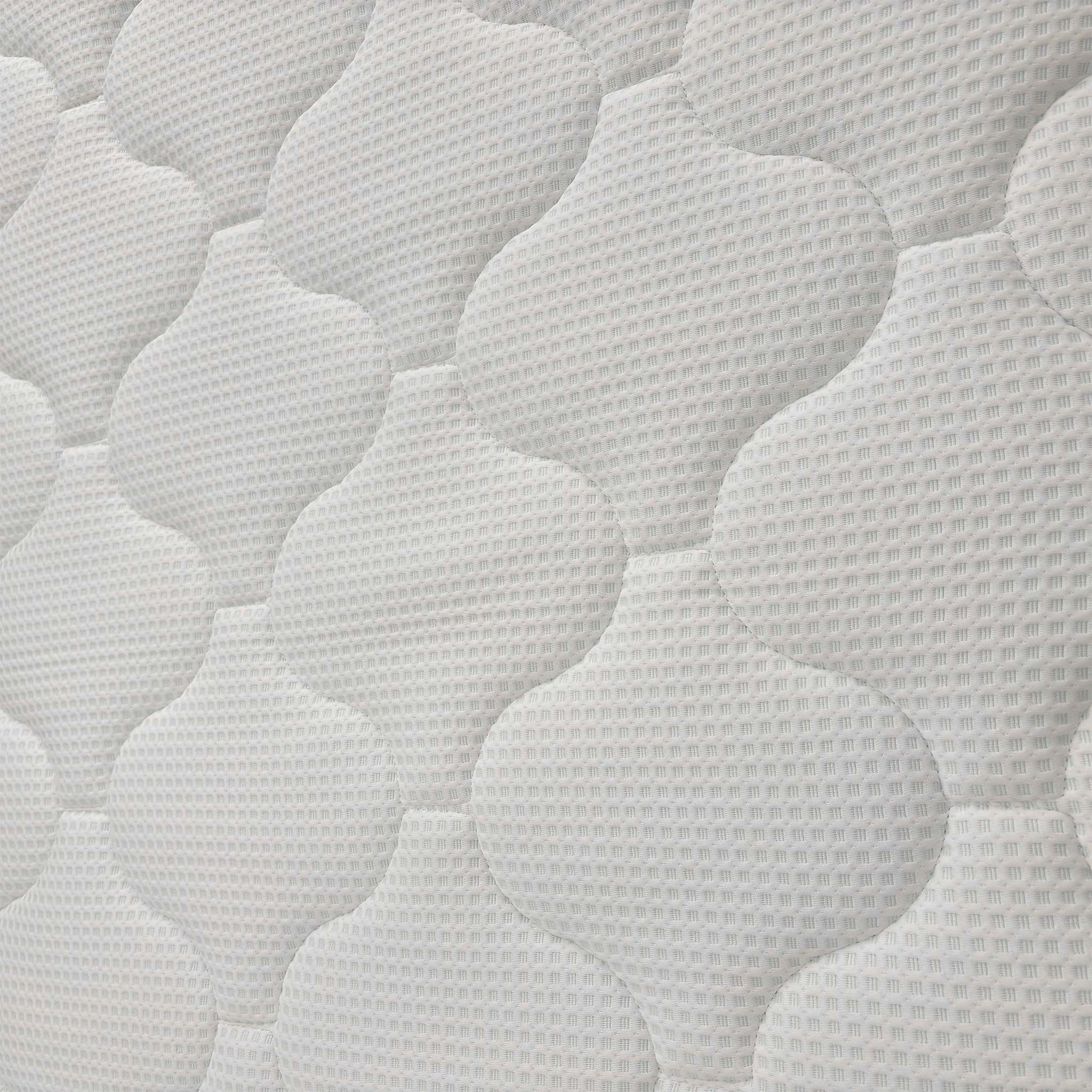Close-up of the mattress surface, showcasing the breathable "Cool-To-Touch" fabric and the intricate quilted pattern of the top layer.
