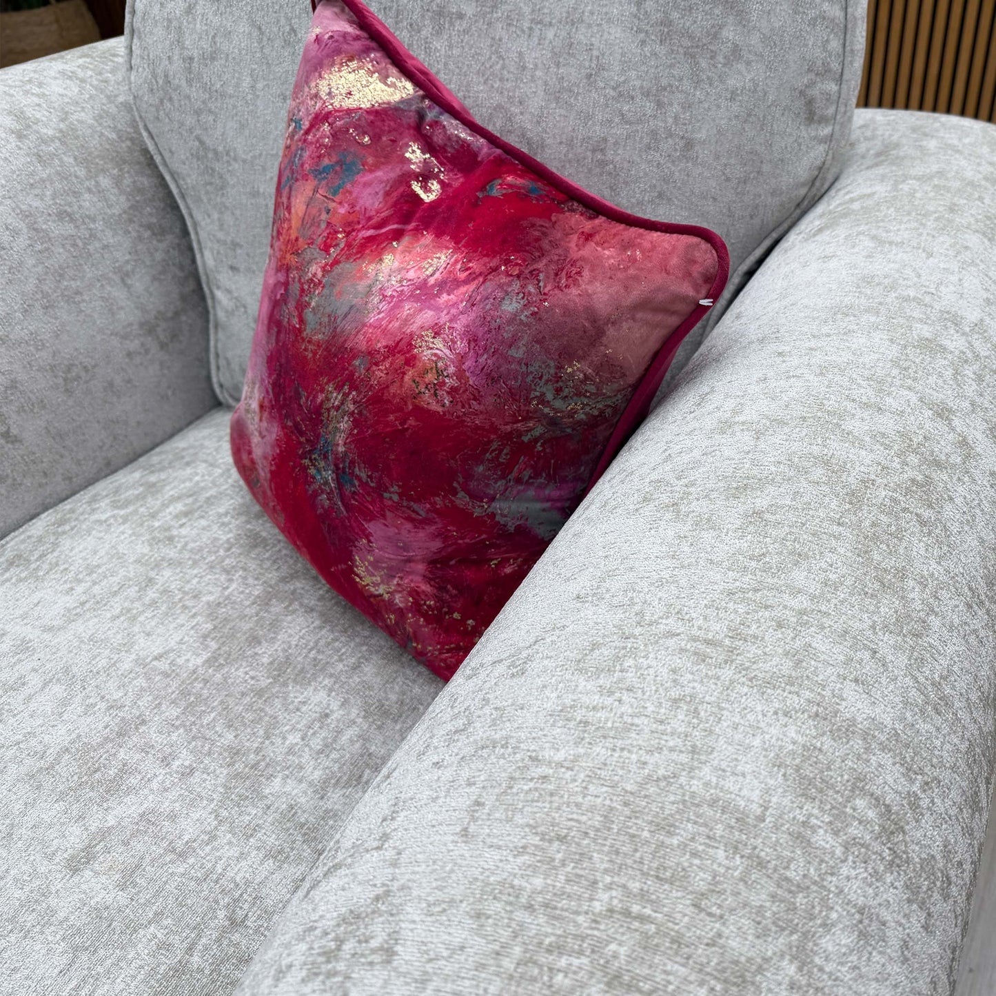 Close-up of the textured pearl chenille fabric on the 'Melody' chair, highlighting the high-quality weave and subtle sheen of the upholstery.