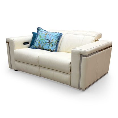 View of the 'Cora' sofa with headrests fully extended, demonstrating the customizable comfort levels of the power headrest feature.