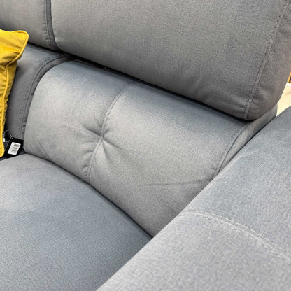 Close-up of the grey velvet fabric on the 'Ezra' sofa, showcasing the high-quality material and subtle sheen of the upholstery.