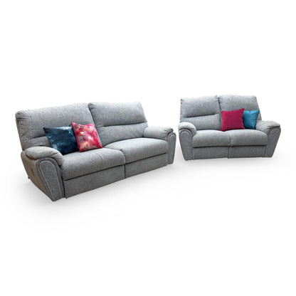 View of the 'Willow' grey fabric sofa set, showing the plush cushioning and modern aesthetic of both the 3-seater and 2-seater units.