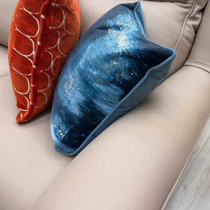 Close-up of the light beige leather upholstery, showing the fine grain and premium quality of the natural leather material.