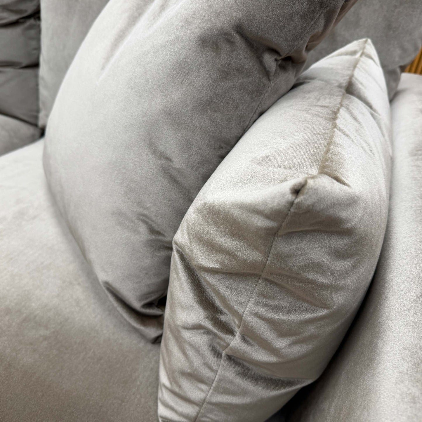 Close-up of the plush mink velvet fabric, detailing the soft texture and subtle sheen of the high-quality upholstery.