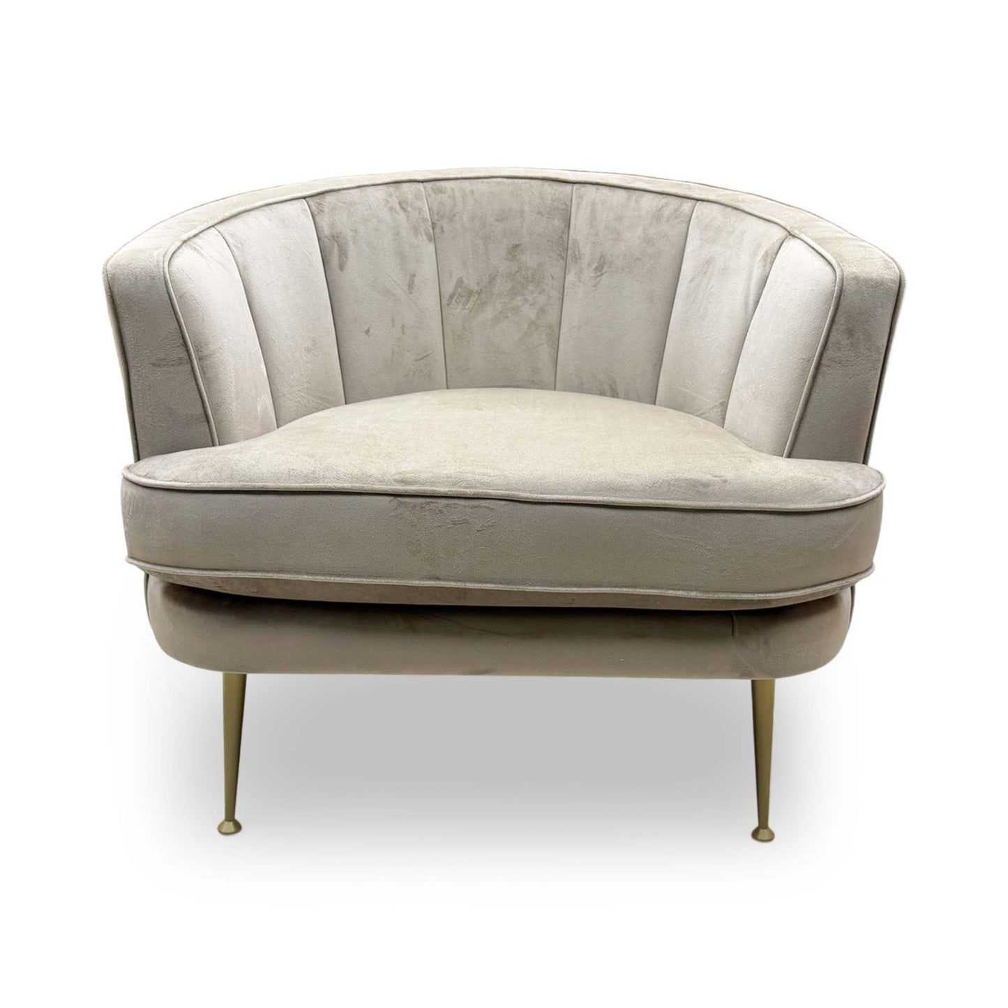 Front-angle view showing the visual warmth of the latte fabric and the supportive, wrap-around backrest.