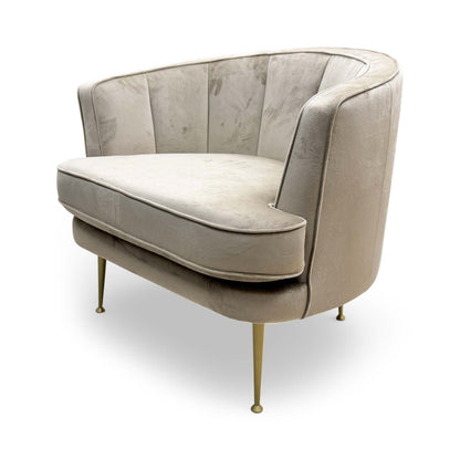 Side profile of the ‘Enchanted’ chair, showcasing the deep-seated comfort and refined contemporary proportions.