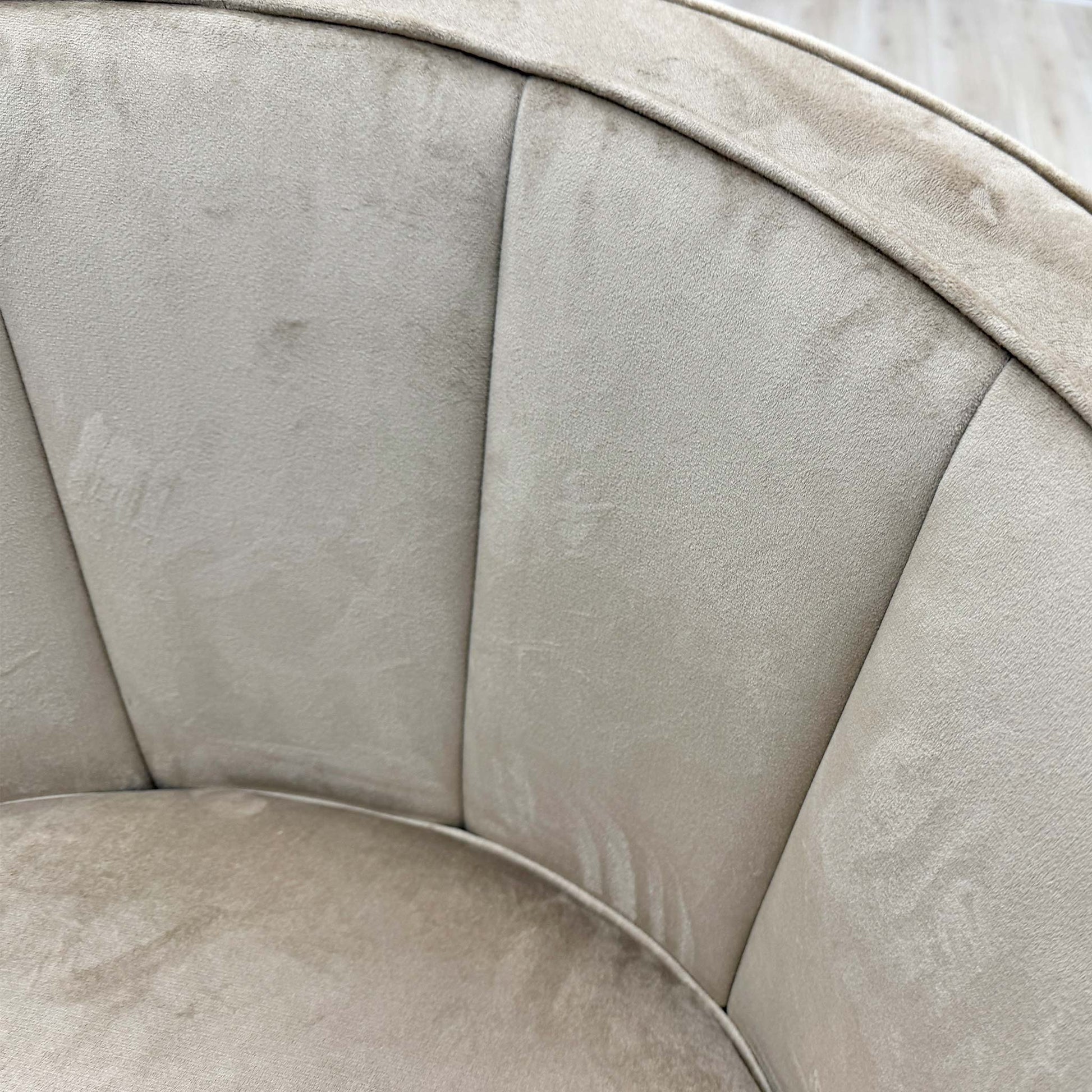 Detailed shot of the seat cushioning and piping detail, highlighting the build quality and comfort of the chair.