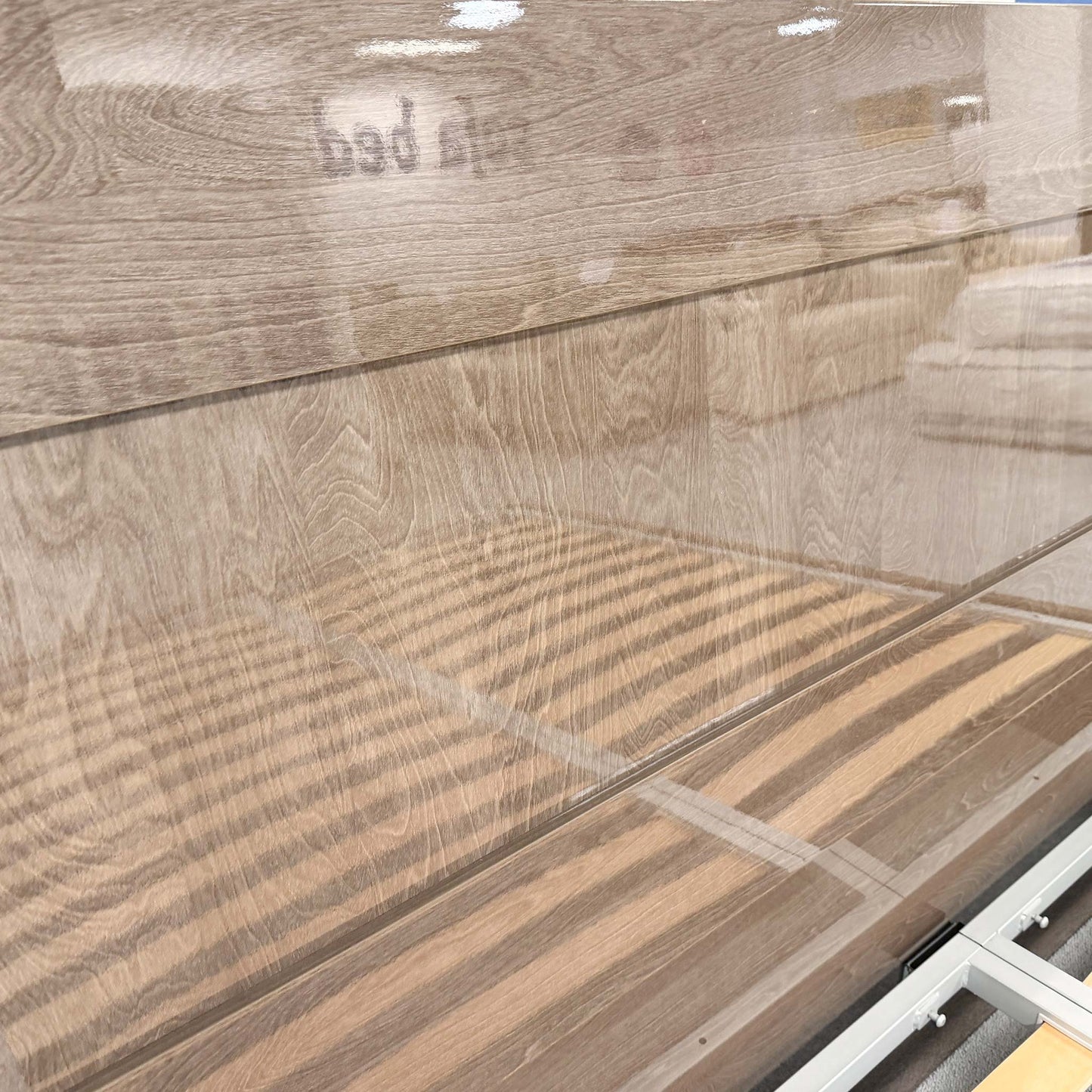 Detailed close-up of the silver birch wood grain and the ambient LED light strip built into the headboard of the Venezia bed.