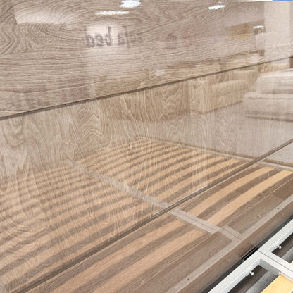 Detailed close-up of the silver birch wood grain and the ambient LED light strip built into the headboard of the Venezia bed.