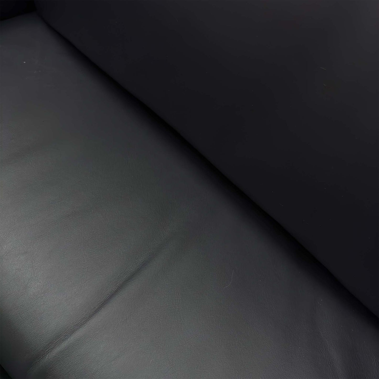 Close-up of the stitching and tailoring details on the high-back headrest, showcasing the expert craftsmanship associated with Parker Knoll furniture.